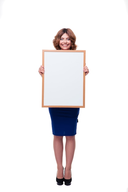 Happy woman holding billboard