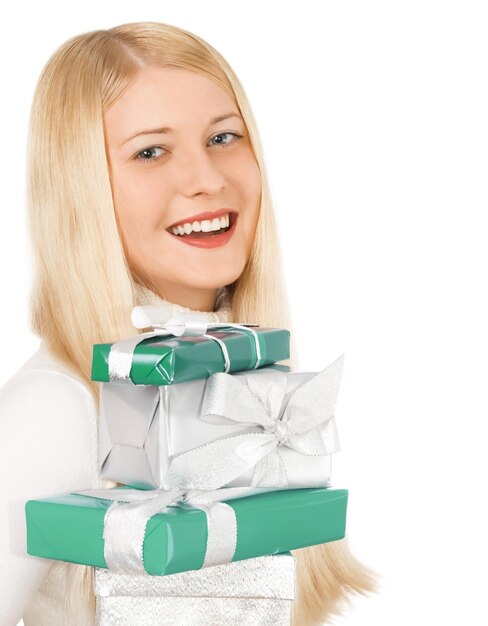 Photo happy woman holding christmas gifts white background with copyspace shopping and holiday