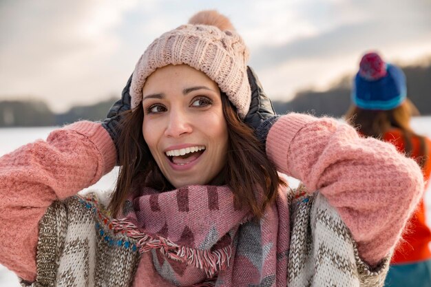 Happy woman holding her woolen hat