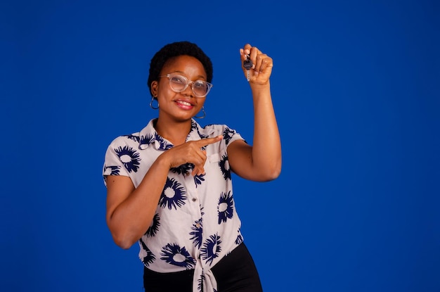 Happy woman holding keys to her new house