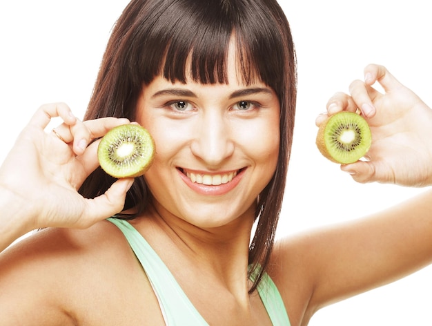 Happy woman holding kiwi