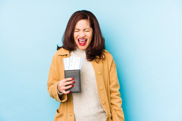 Happy woman holding a passport