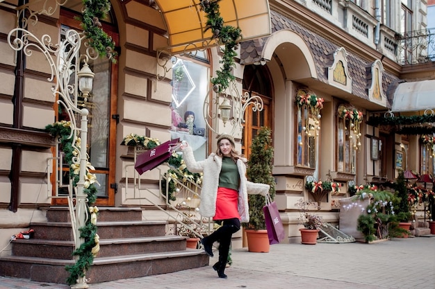 Happy woman holding shopping bags