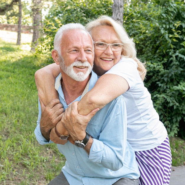 Happy woman hugging man from behind