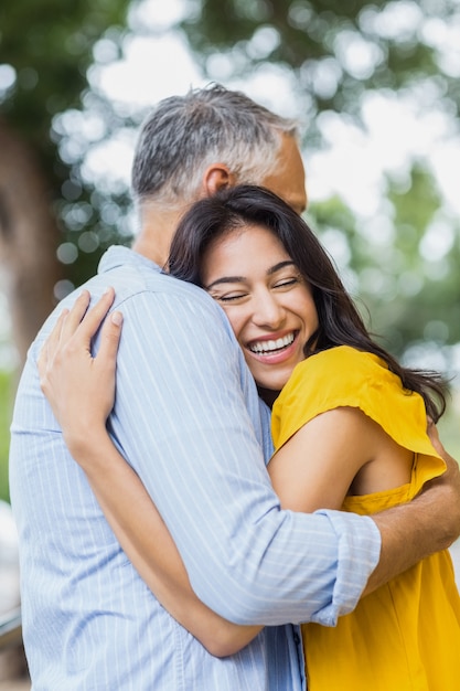 Happy woman hugging man