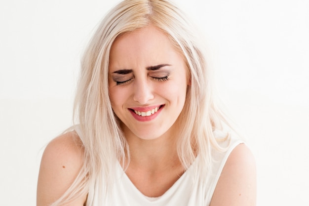 Happy woman laughing isolated on white