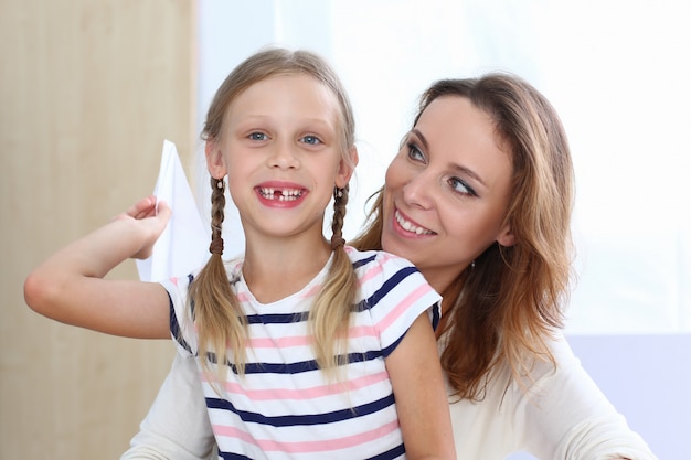 Happy woman looking at her little kid