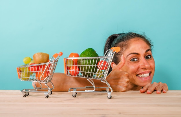 Happy woman made an healthy shopping of fruit