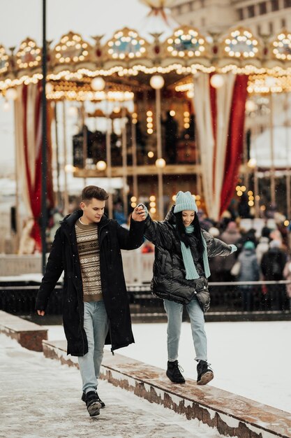 Happy woman and man in the Christmas market