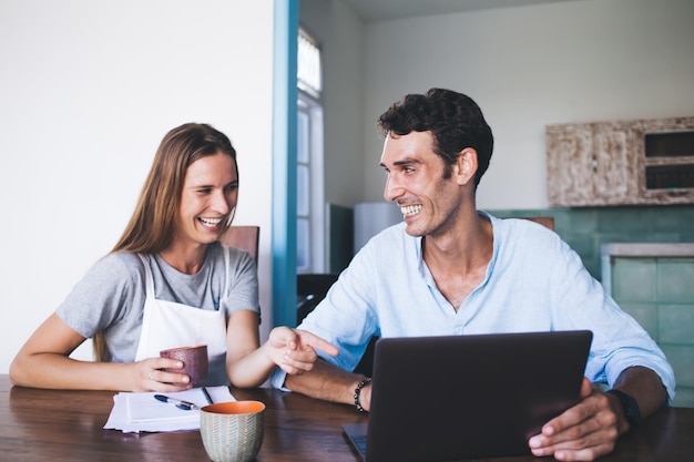 Happy woman and man having fun at home