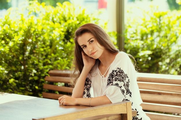 Happy woman at outdoors cafe