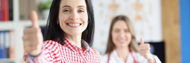 Happy woman patient show thumbs up gesture woman healthy after treatment