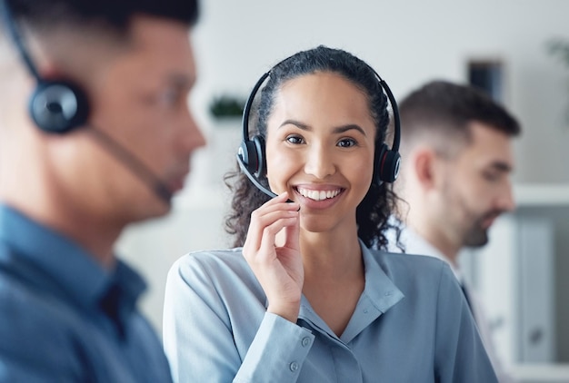 Happy woman in portrait callcenter and headset with CRM communication with technology and contact us Customer service telemarketing or tech support female consultant with smile and help desk