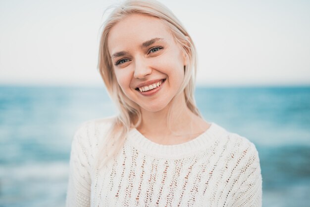 Happy woman resting near sea