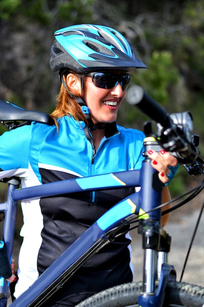 Happy woman riding mountain bike
