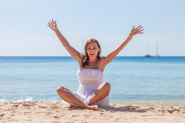 Happy woman on sea beach