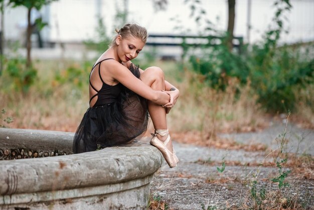 Happy woman sitting outdoors