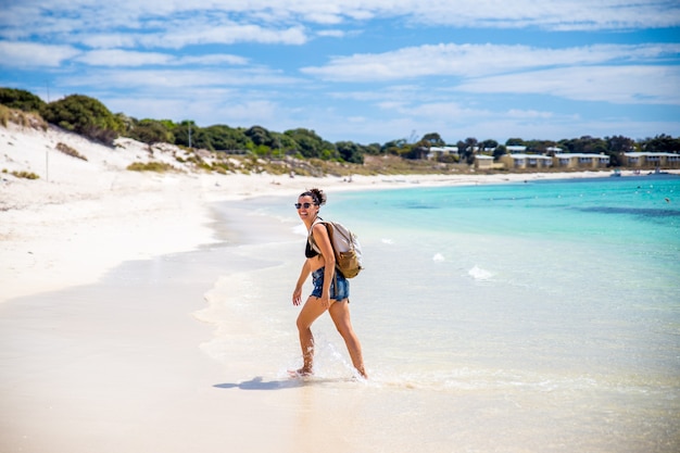 Happy woman smiling on the beach