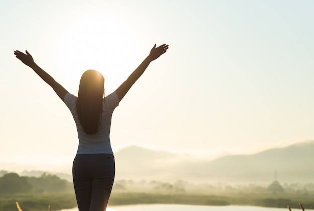 Photo happy woman spreading arms for freedom emotions concept.