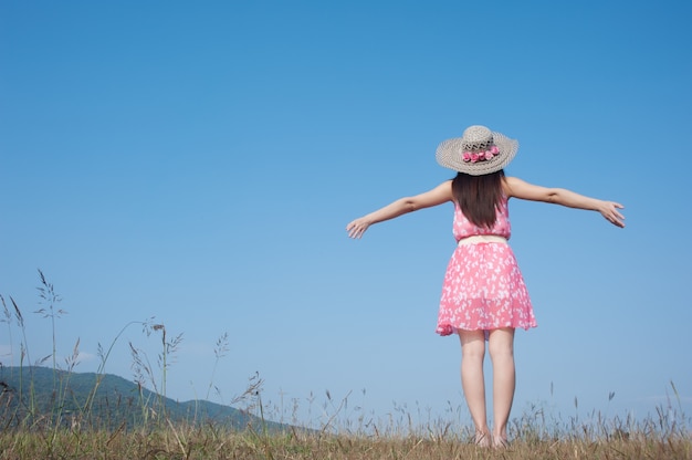 Happy Woman Standing with blue sky