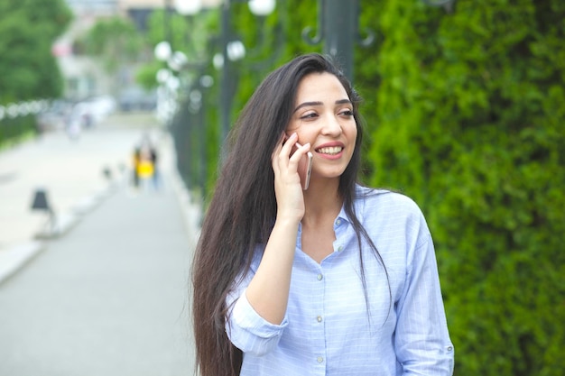 Happy woman talking phone