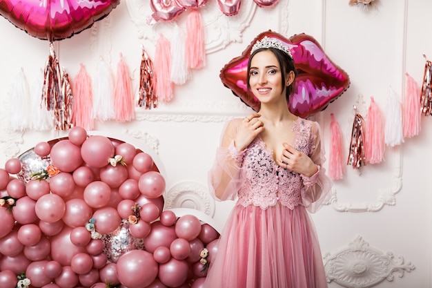 Happy Woman in Tulle Dress with Pink ballons. luxury