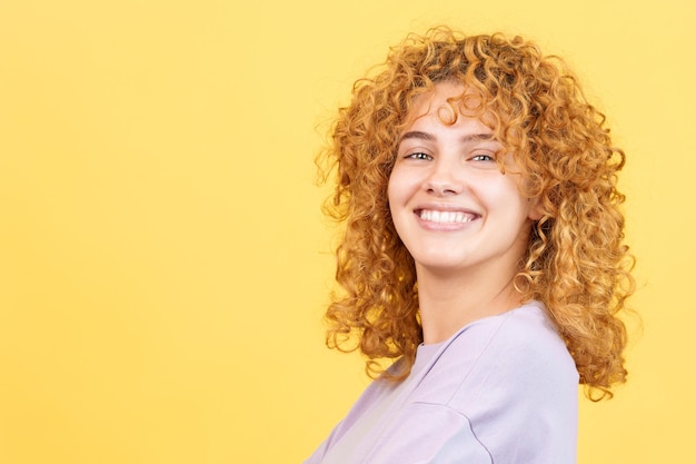 Happy woman turning to smile at the camera