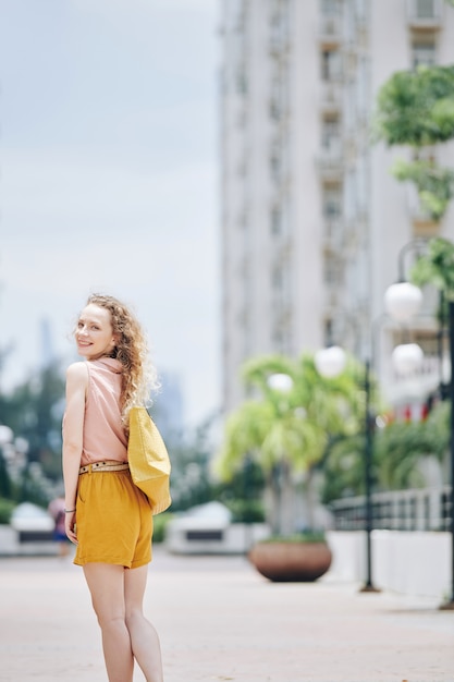 Happy woman walking outdoors