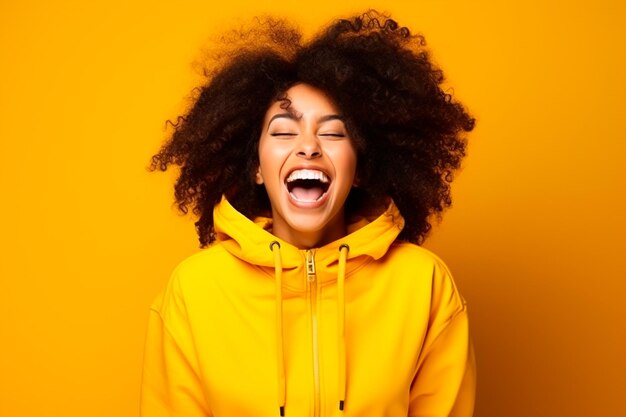 A happy woman with afro hairs on yellow background