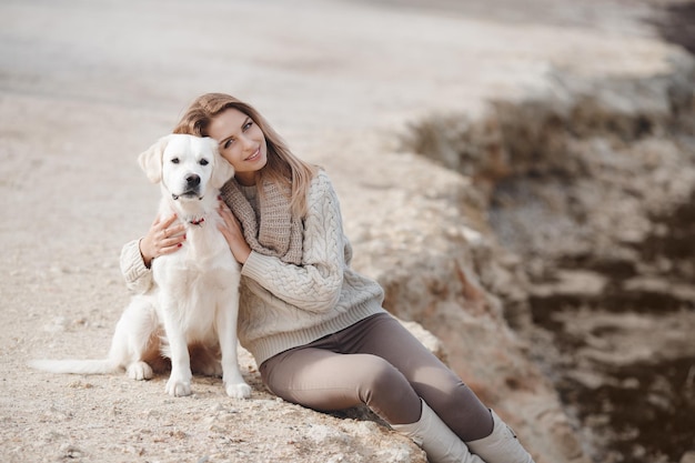 happy woman with dog retriever