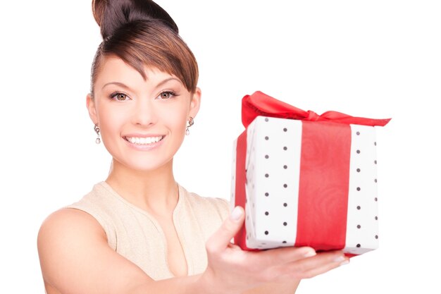 happy woman with gift box over white wall