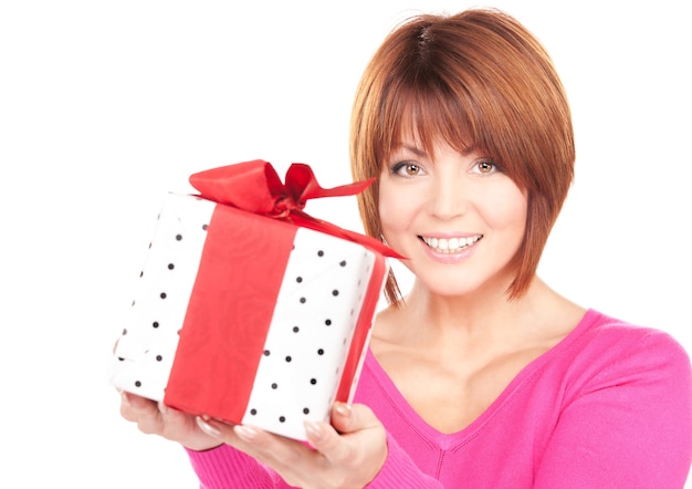 happy woman with gift box over white wall