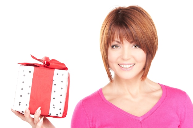 happy woman with gift box over white wall