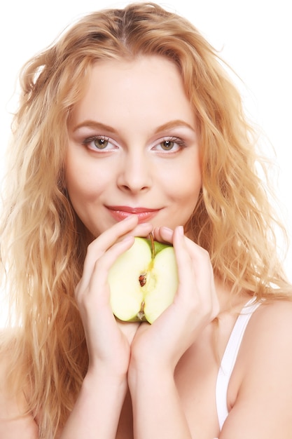 Happy woman with green apple isolated on white background