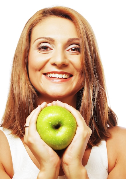 Happy woman with green apple