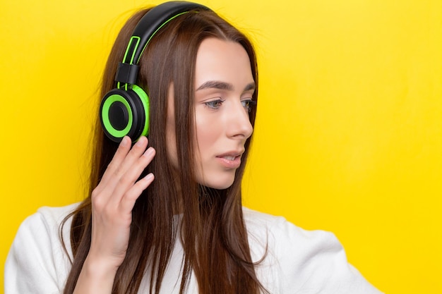 Happy woman with headphones listening to music