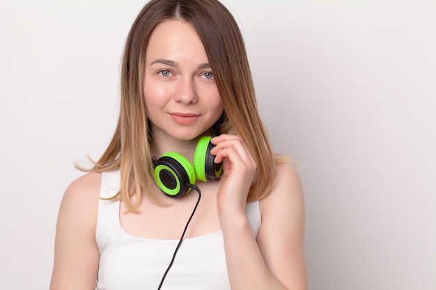 Happy woman with headphones listening to music