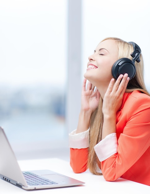 happy woman with headphones listening to music