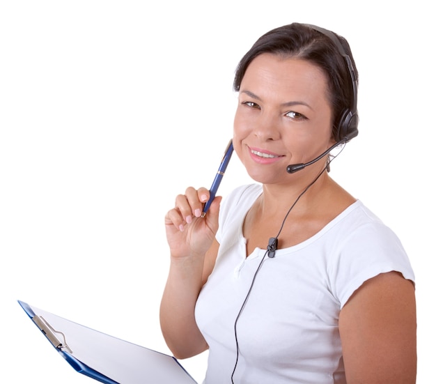 Foto donna felice con auricolare che lavora al callcenter tieni gli appunti su uno sfondo bianco