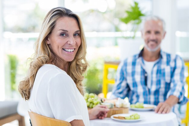 Happy woman with man in restaurant