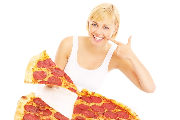 a happy woman with pizza over white background