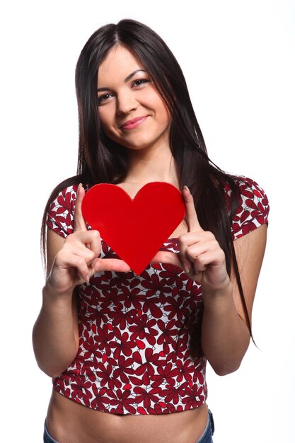 Happy woman with red heart at white background