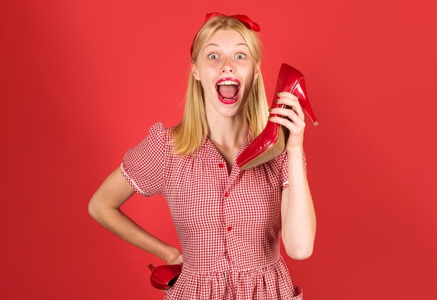 Happy woman with red shoes. Shopping. Advertising. Discount and sale. Beauty and fashion.