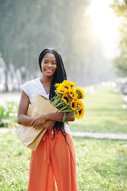 Happy woman with sunflowers