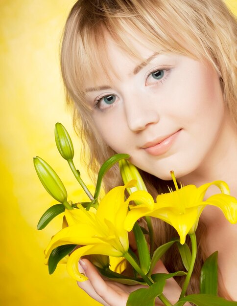 Happy woman with yellow flowers