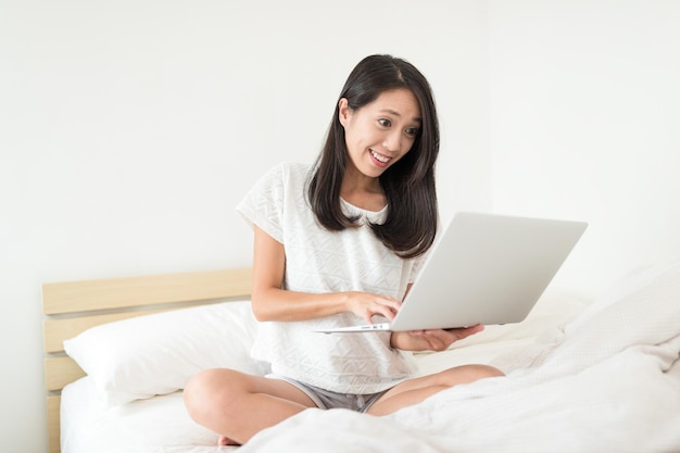 Happy woman work on laptop computer