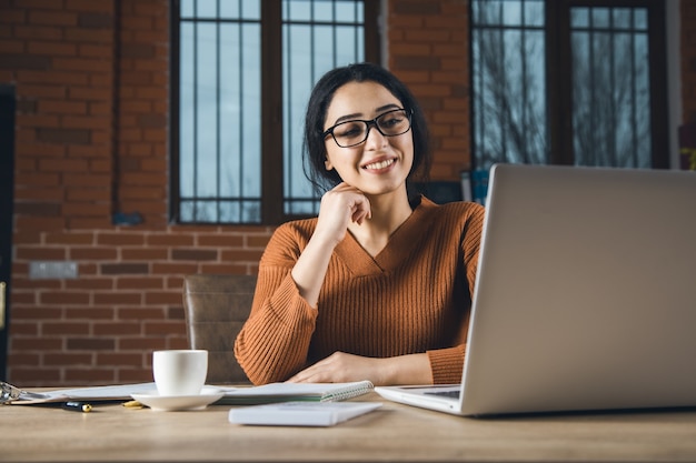 Happy woman working in the office