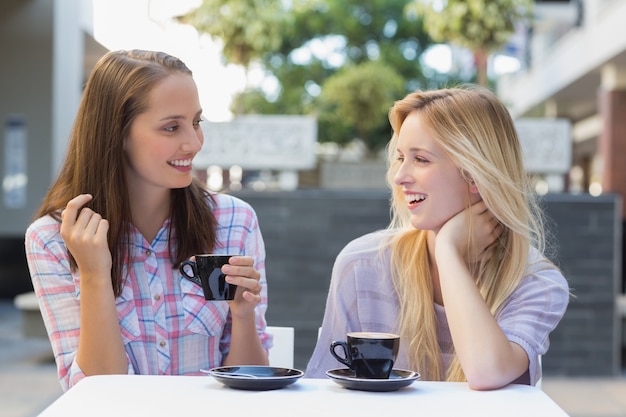 Happy women friends talking together