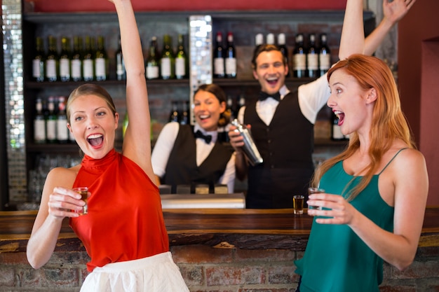 Happy women having tequila