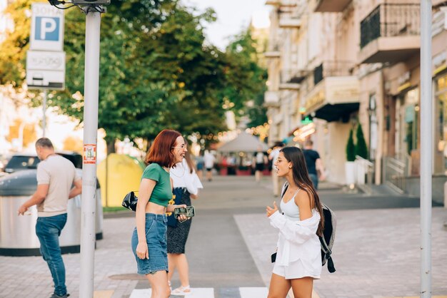 Happy Women Talking And Laughing At The City Street